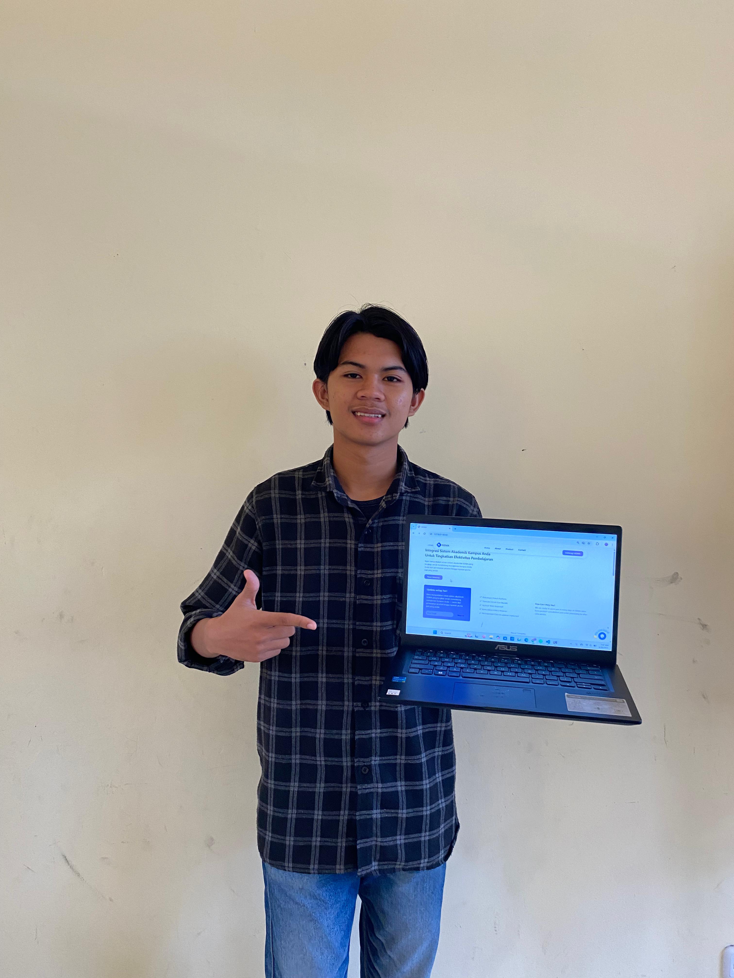 Smiling man in black suit holding a card in his right hand, standing outside